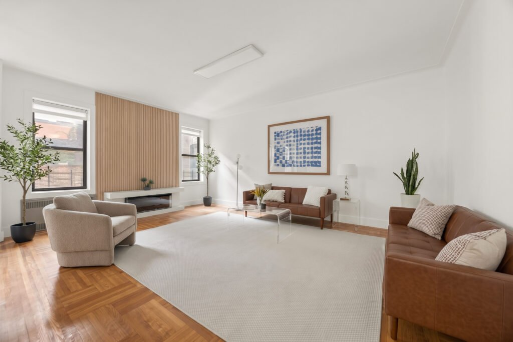 Living room with electric fireplace and wood-slat wall at 570 Westminster Rd #B19